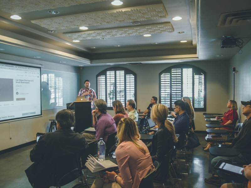 Team members engaged in professional leadership training and development workshop